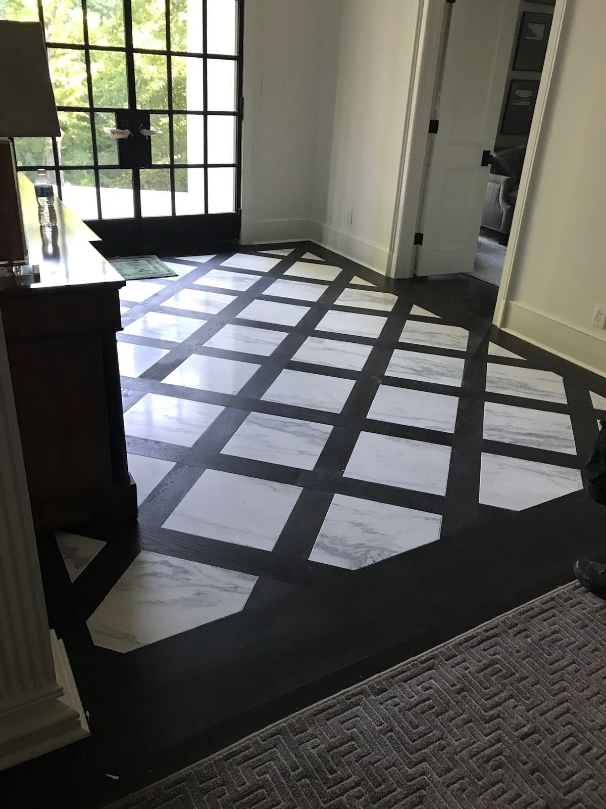 We do design pattern for flooring to make statement when you enter this home!!!