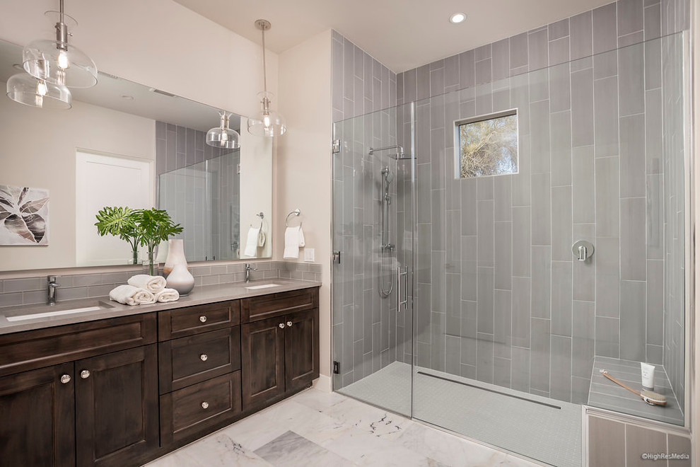 Inspiration for a transitional master bathroom in Phoenix with dark wood cabinets, an alcove shower, gray tile, an undermount sink and engineered quartz benchtops.