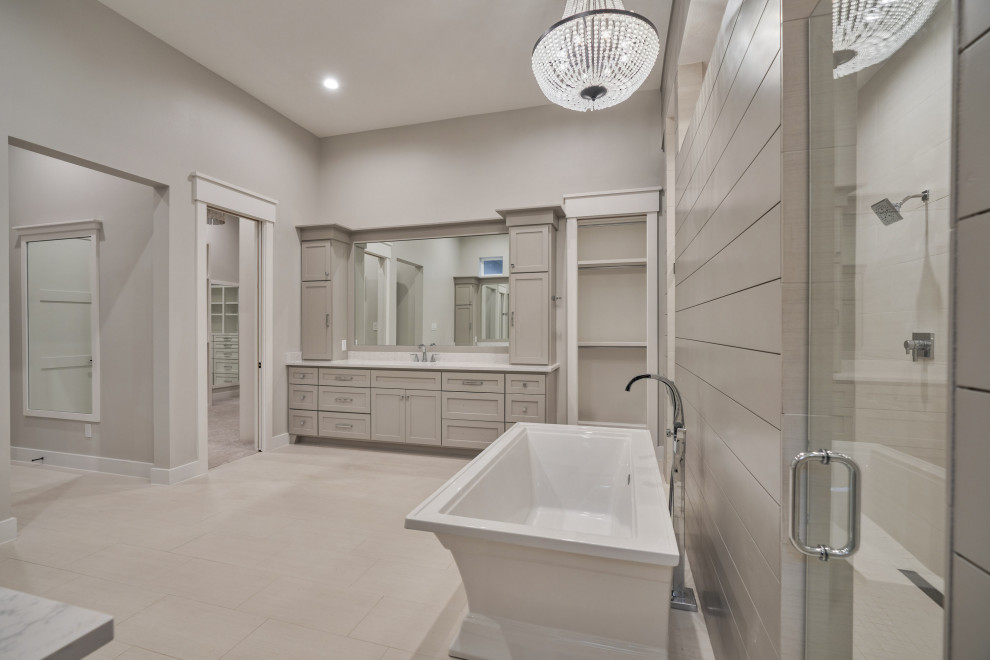 Example of a large arts and crafts master porcelain tile, beige floor, double-sink and shiplap wall bathroom design in Houston with recessed-panel cabinets, gray cabinets, a one-piece toilet, gray walls, an undermount sink, a hinged shower door, white countertops and a built-in vanity