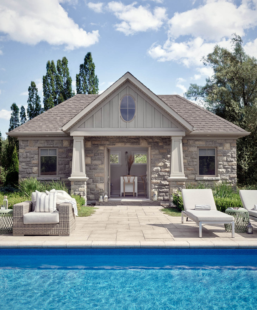 Example of a large transitional backyard stone and rectangular lap pool house design