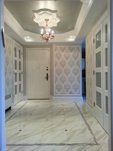 Mid-sized transitional foyer in New York with porcelain floors, a white front door, grey walls and a single front door.