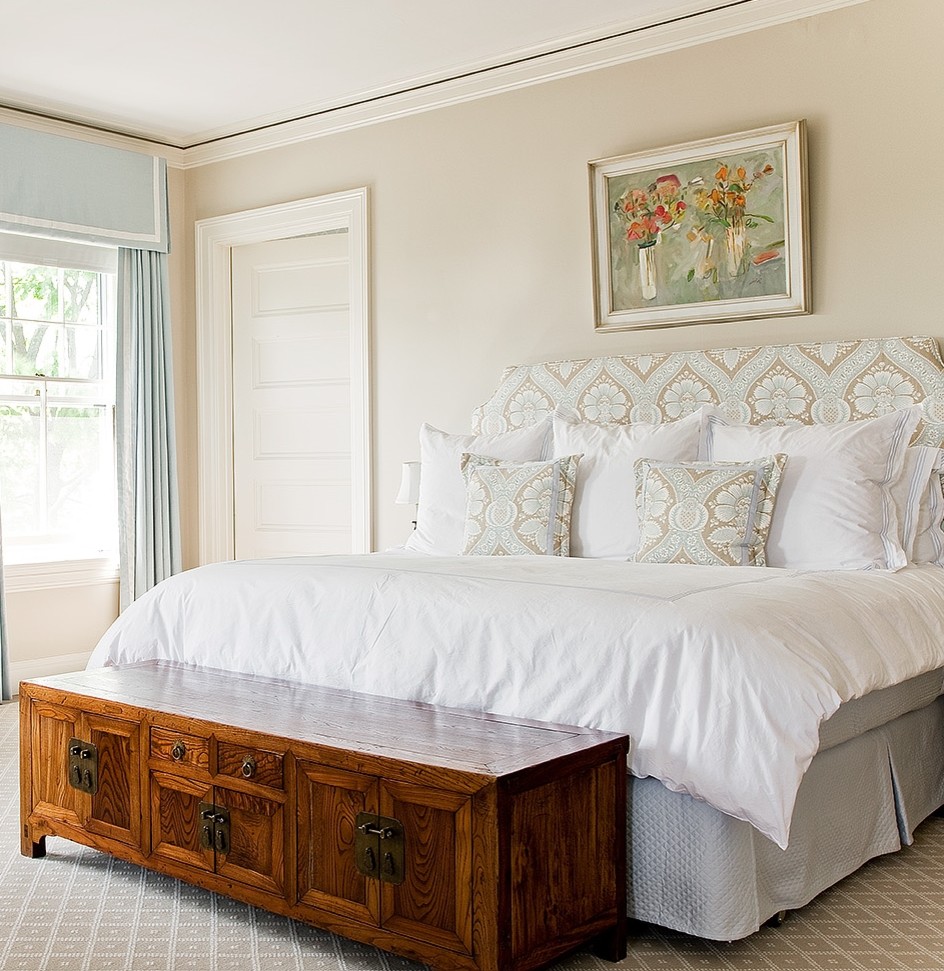 Photo of a traditional master bedroom in Boston with beige walls.