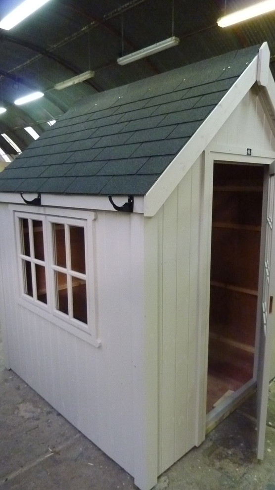 Photo of a medium sized modern detached garden shed in London.