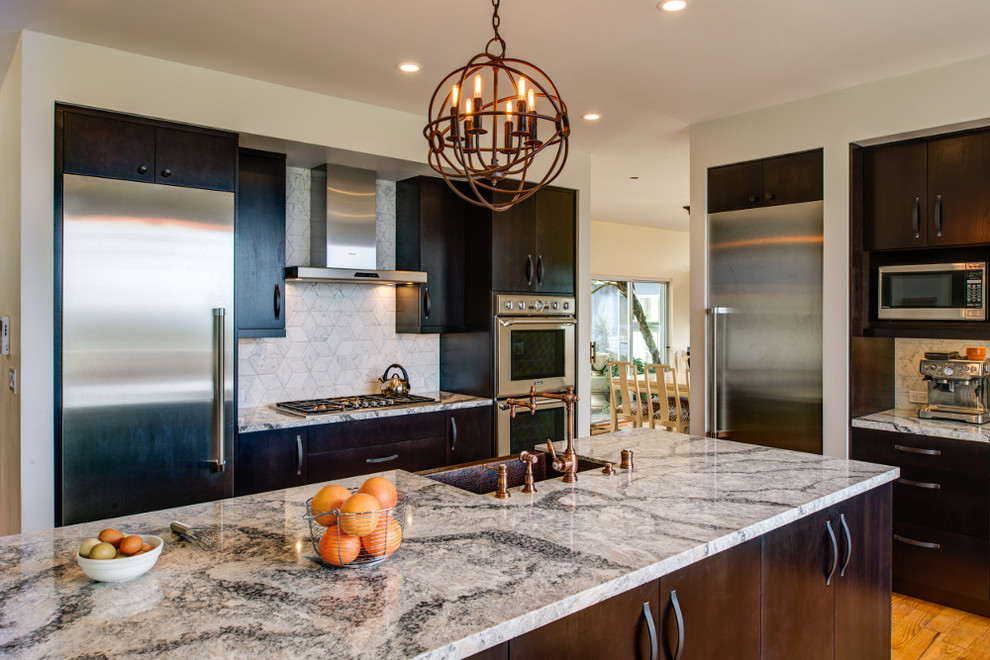 Mid-sized transitional l-shaped separate kitchen in San Francisco with a farmhouse sink, flat-panel cabinets, brown cabinets, quartz benchtops, white splashback, stone tile splashback, stainless steel appliances, light hardwood floors and with island.