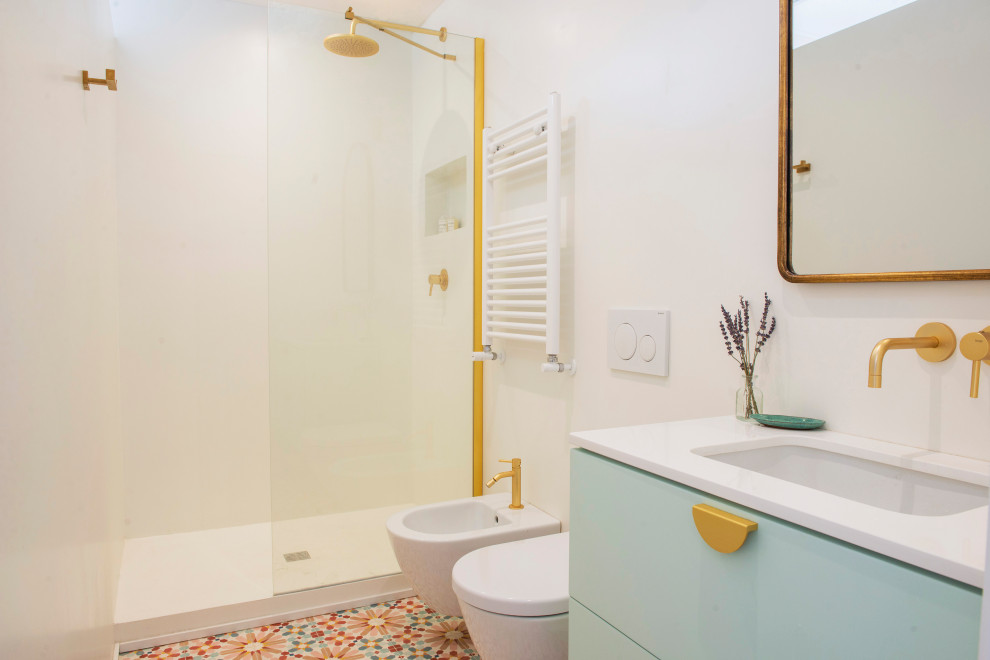 Inspiration for a small modern 3/4 bathroom in Rome with flat-panel cabinets, turquoise cabinets, a wall-mount toilet, white walls, cement tiles, an undermount sink, engineered quartz benchtops, multi-coloured floor, an open shower, white benchtops, a single vanity and a floating vanity.