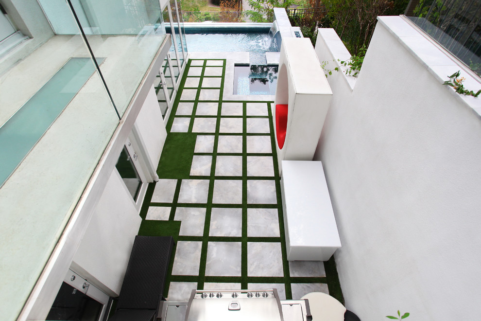 Inspiration for a small modern side yard patio in New York with an outdoor kitchen, concrete slab and no cover.