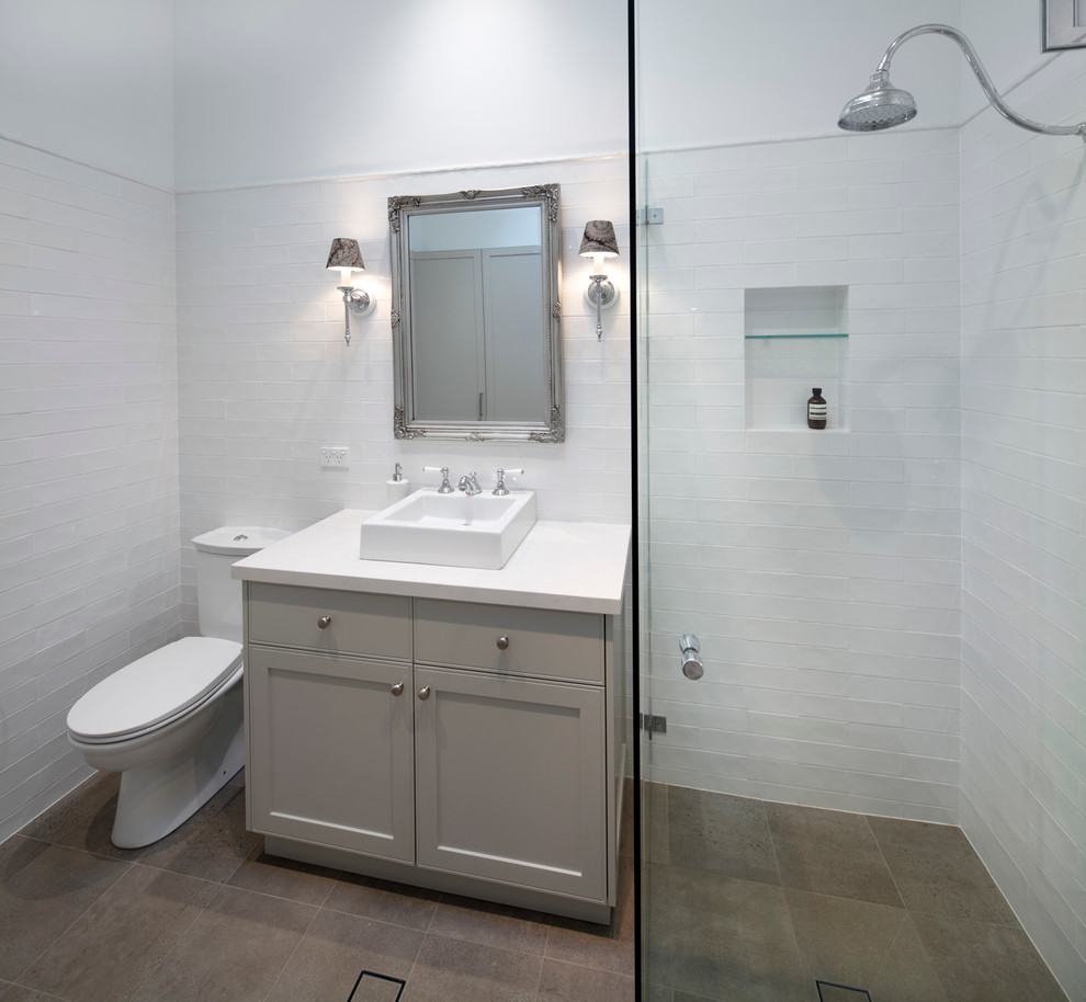 Design ideas for a modern bathroom in Sydney with shaker cabinets, a corner shower, a two-piece toilet, white tile, subway tile, white walls, a vessel sink and a hinged shower door.