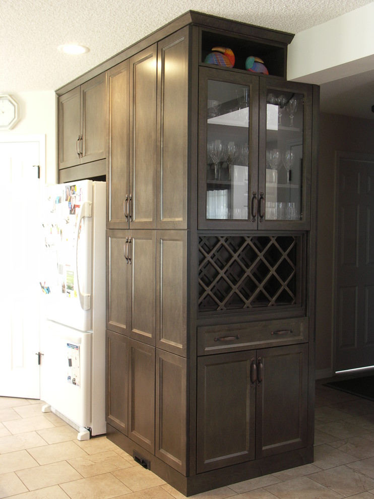 Example of a mid-sized transitional u-shaped porcelain tile open concept kitchen design in Edmonton with an undermount sink, recessed-panel cabinets, dark wood cabinets, quartzite countertops, multicolored backsplash, matchstick tile backsplash, white appliances and two islands