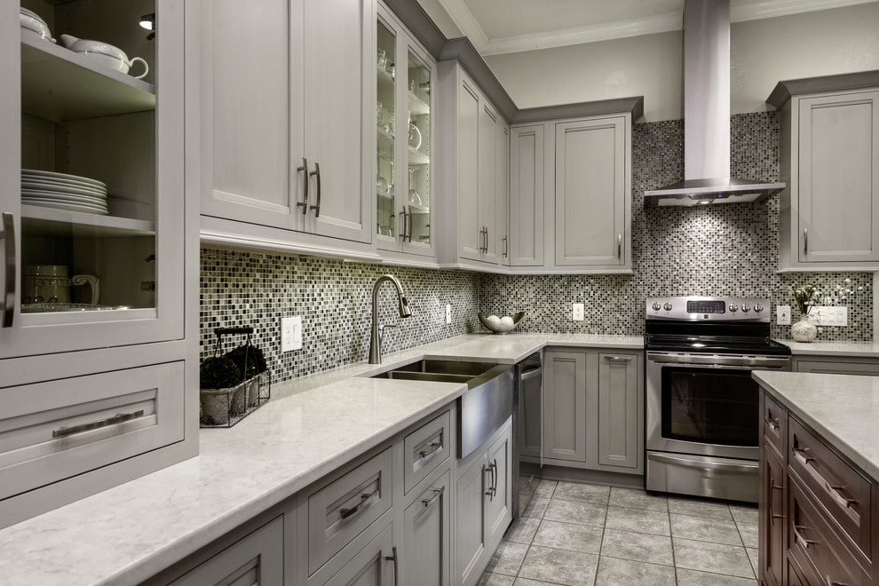 This is an example of a transitional separate kitchen in Jacksonville with a farmhouse sink, flat-panel cabinets, grey cabinets, quartz benchtops, multi-coloured splashback, mosaic tile splashback, stainless steel appliances and porcelain floors.