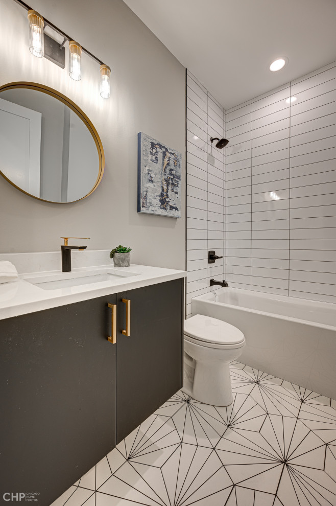 Inspiration for a large contemporary bathroom in Chicago with flat-panel cabinets, black cabinets, an alcove tub, a shower/bathtub combo, a one-piece toilet, white tile, ceramic tile, grey walls, ceramic floors, an undermount sink, quartzite benchtops, white floor, white benchtops, a single vanity and a floating vanity.