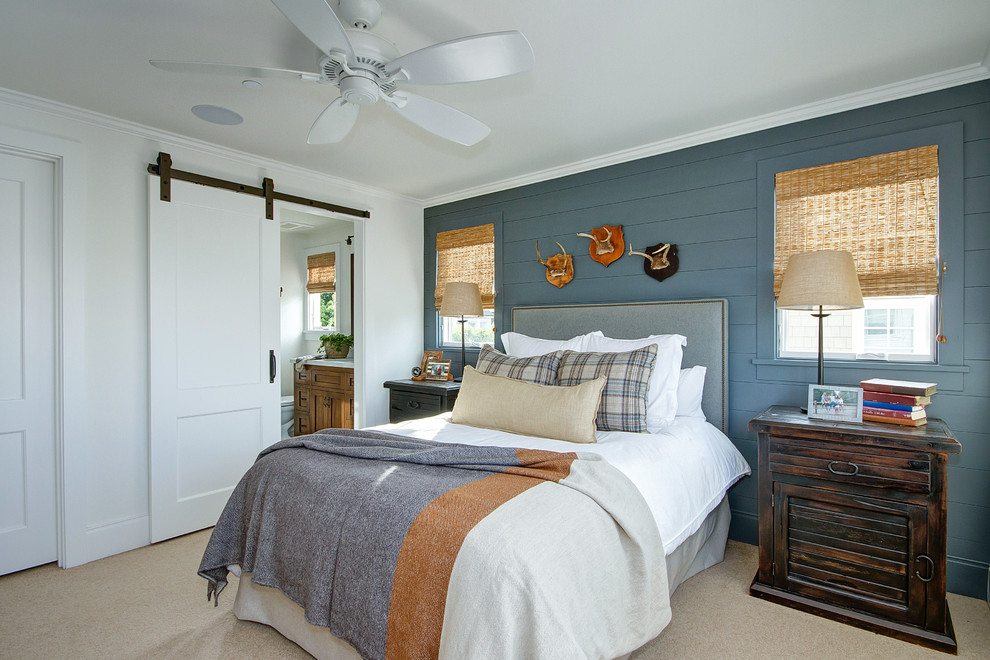 Cottage carpeted and beige floor bedroom photo in Orange County with blue walls