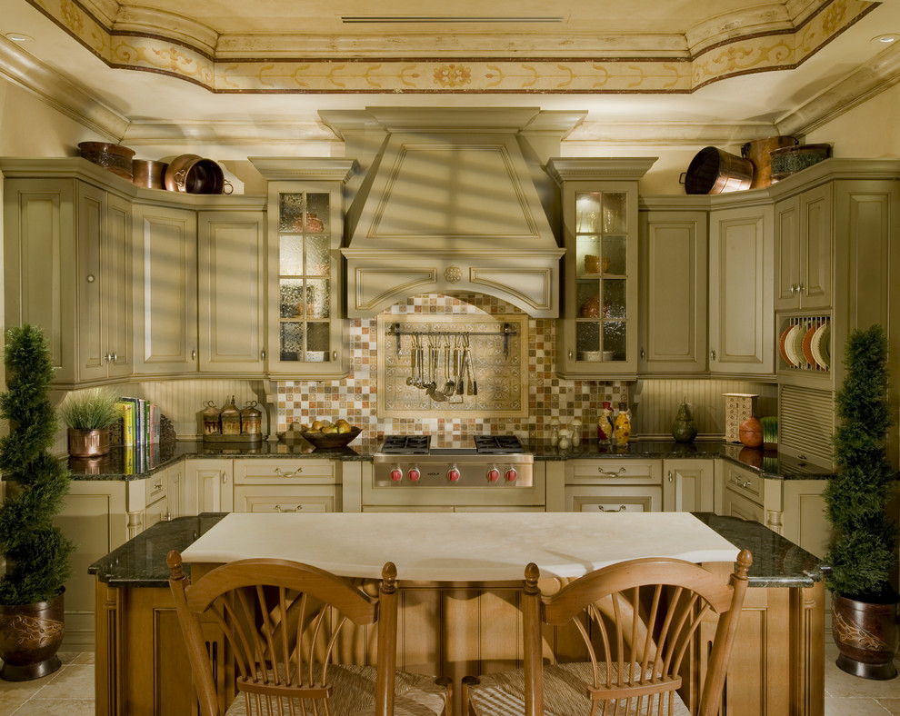 Inspiration for a traditional kitchen in Miami with raised-panel cabinets.