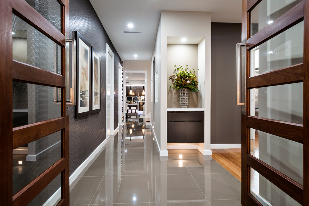 Inspiration for a mid-sized contemporary entry hall in Canberra - Queanbeyan with metallic walls, porcelain floors, a double front door, a dark wood front door and grey floor.