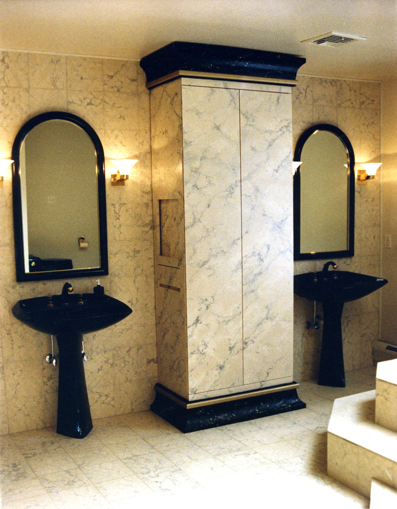 This is an example of a large transitional master bathroom in Newark with a pedestal sink, a drop-in tub, beige tile, white tile, yellow tile, stone tile, yellow walls and marble floors.