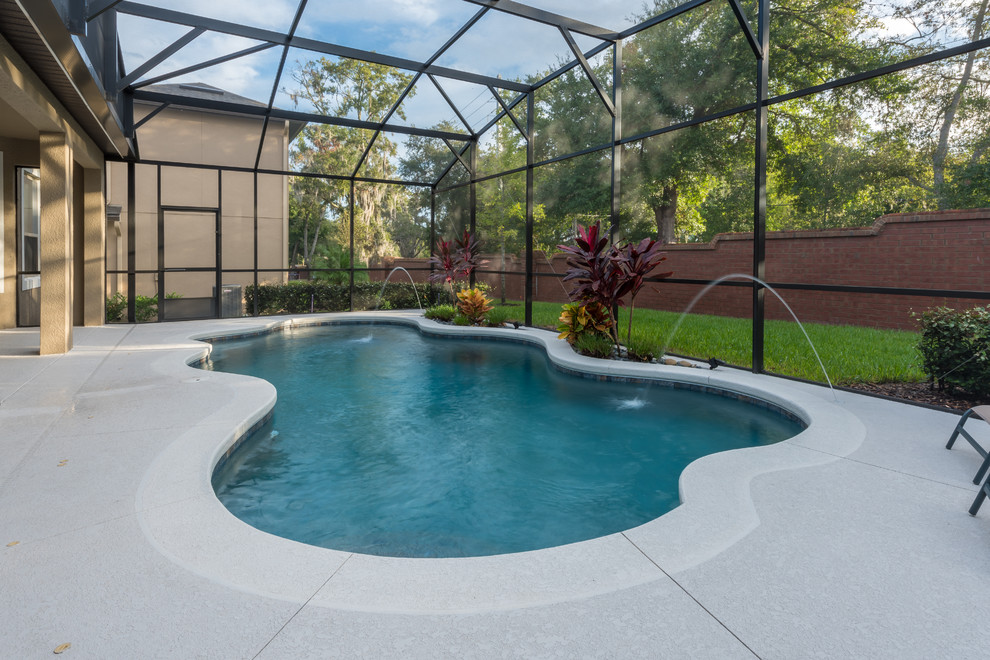 Example of a mid-sized transitional indoor custom-shaped pool fountain design in Orlando