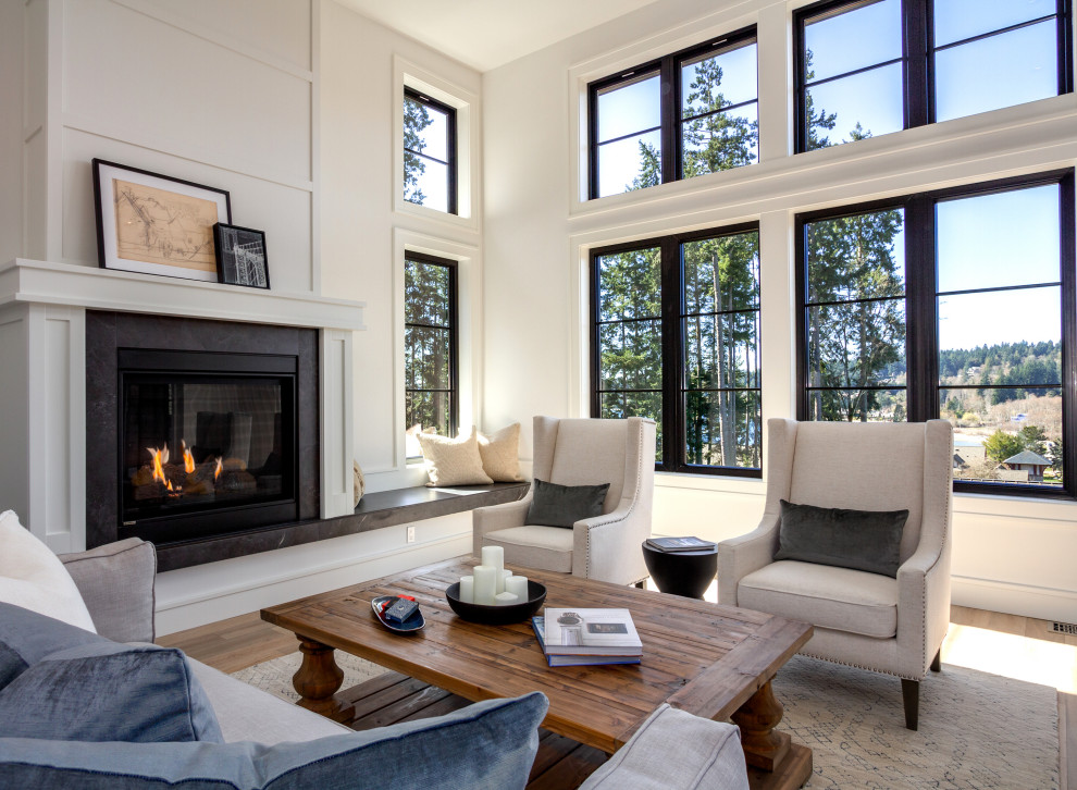 Mid-sized transitional open concept living room in Seattle with a standard fireplace, a stone fireplace surround, brown floor, panelled walls, white walls, no tv and laminate floors.