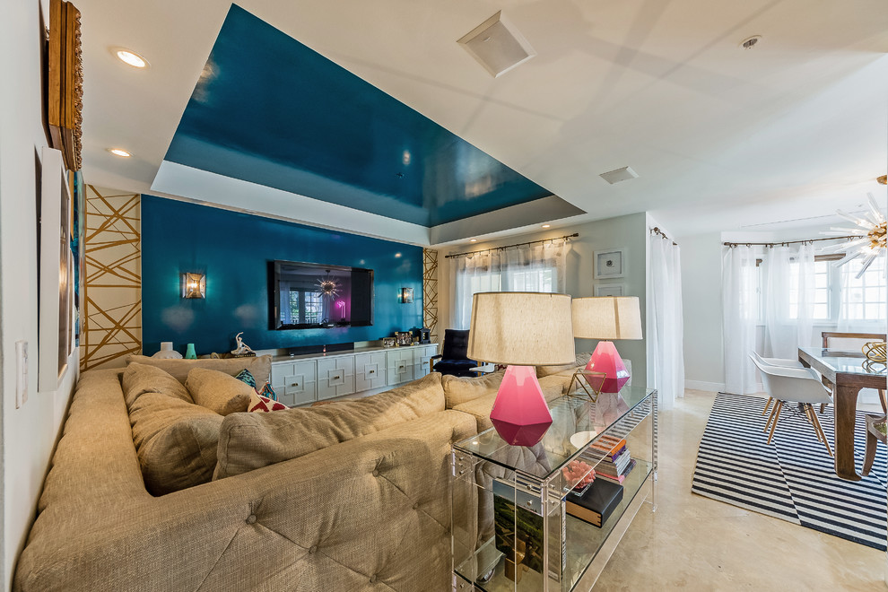 This is an example of a mid-sized eclectic enclosed family room in Miami with blue walls, ceramic floors, no fireplace and a wall-mounted tv.
