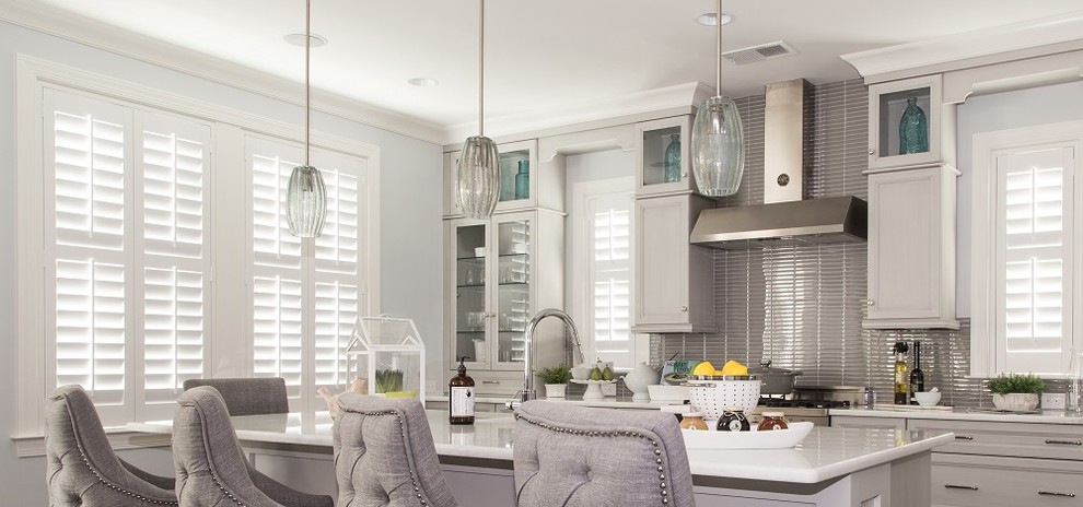 Design ideas for a large transitional l-shaped open plan kitchen in Las Vegas with a farmhouse sink, recessed-panel cabinets, grey cabinets, quartzite benchtops, grey splashback, matchstick tile splashback, stainless steel appliances and with island.