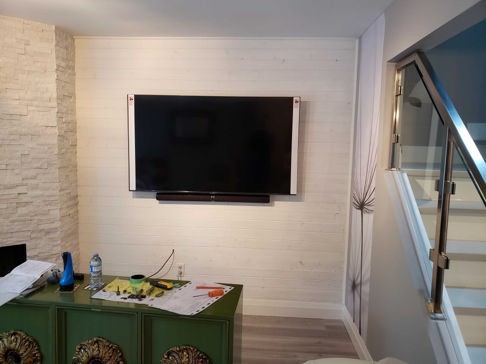 Inspiration for a mid-sized transitional basement in Tampa with a home bar and white walls.