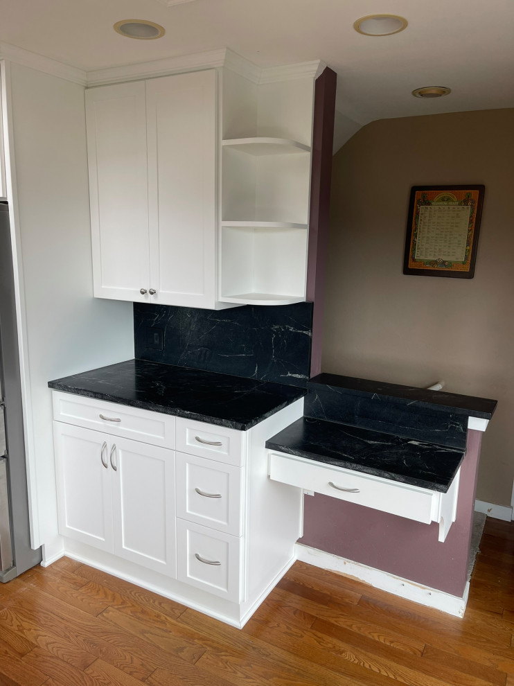 Custom White Kitchen Remodel With Black Quartz Counters