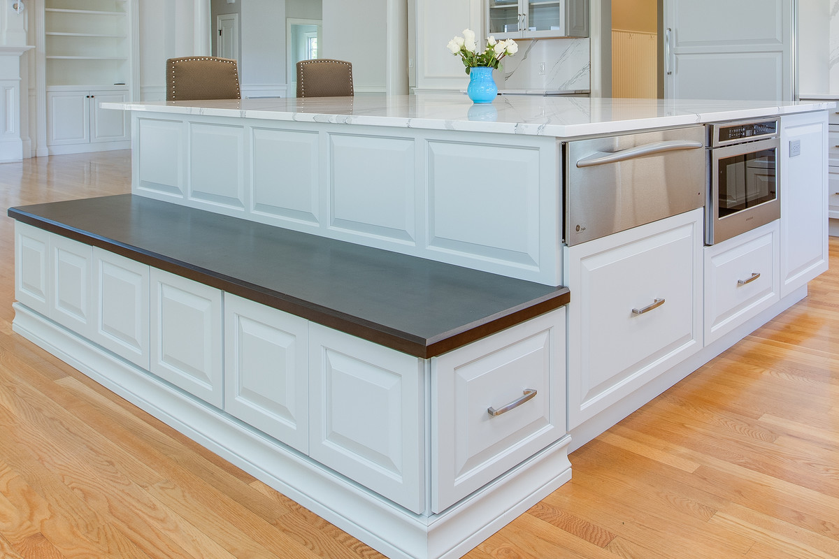 Open concept kitchen - large transitional l-shaped medium tone wood floor open concept kitchen idea in Boston with an undermount sink, raised-panel cabinets, gray cabinets, quartz countertops, stone slab backsplash, paneled appliances and an island