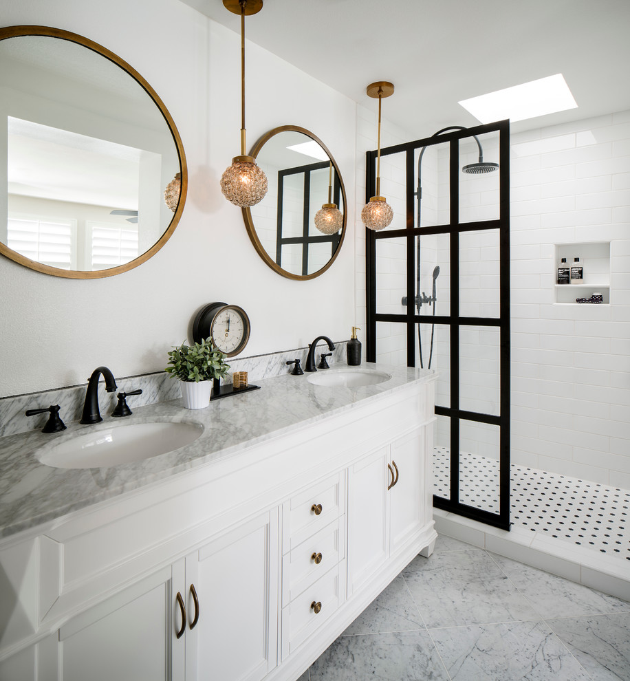 Inspiration for a mid-sized modern master bathroom in San Francisco with recessed-panel cabinets, white cabinets, an open shower, a two-piece toilet, white tile, subway tile, white walls, marble floors, an undermount sink and marble benchtops.