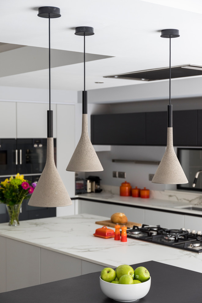 Design ideas for a large contemporary open plan kitchen in West Midlands with a single-bowl sink, grey cabinets, solid surface benchtops, white splashback, marble splashback, coloured appliances, porcelain floors, with island and grey floor.