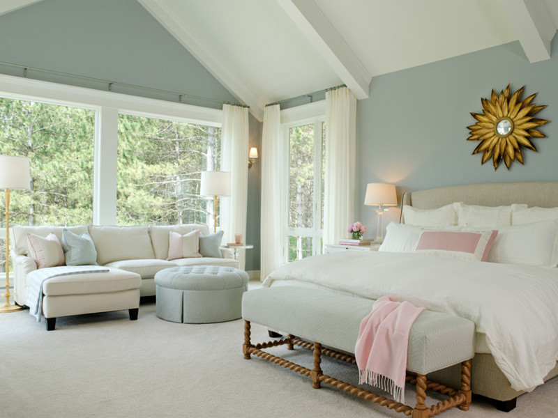 Design ideas for a large traditional master bedroom in Minneapolis with blue walls and carpet.