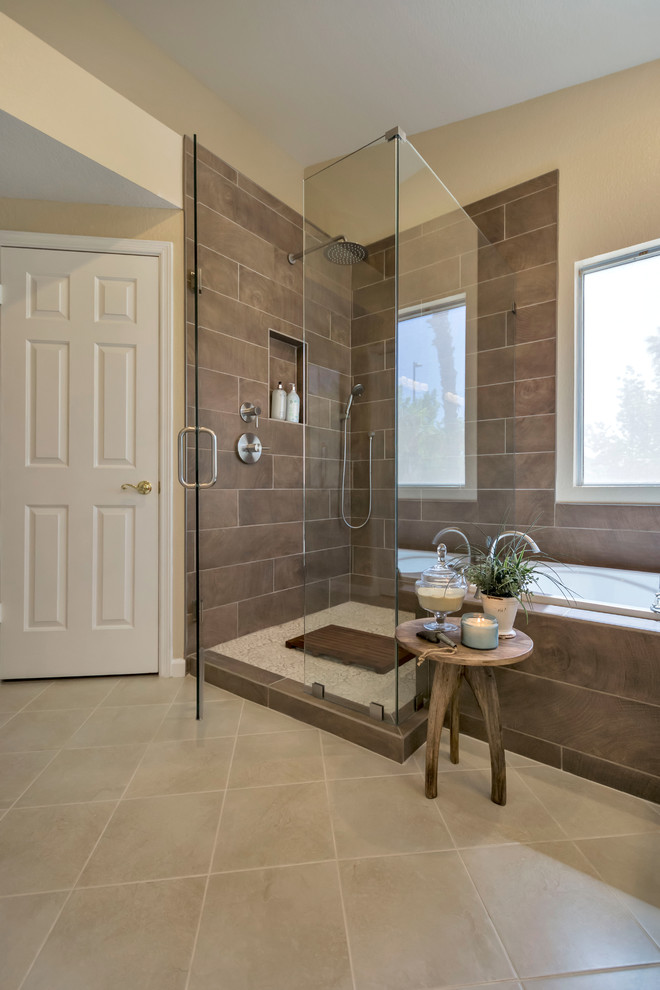 Design ideas for a mid-sized traditional master bathroom in Phoenix with raised-panel cabinets, white cabinets, a drop-in tub, a corner shower, brown tile, porcelain tile, beige walls, porcelain floors, an undermount sink, granite benchtops, beige floor and a hinged shower door.