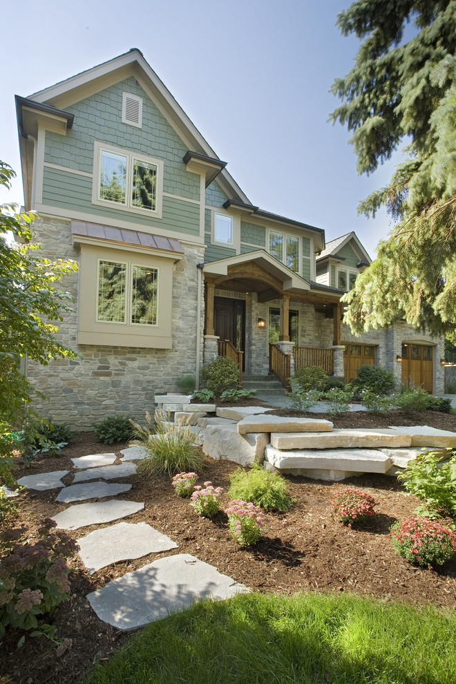 Large arts and crafts two-storey exterior in Chicago with concrete fiberboard siding.