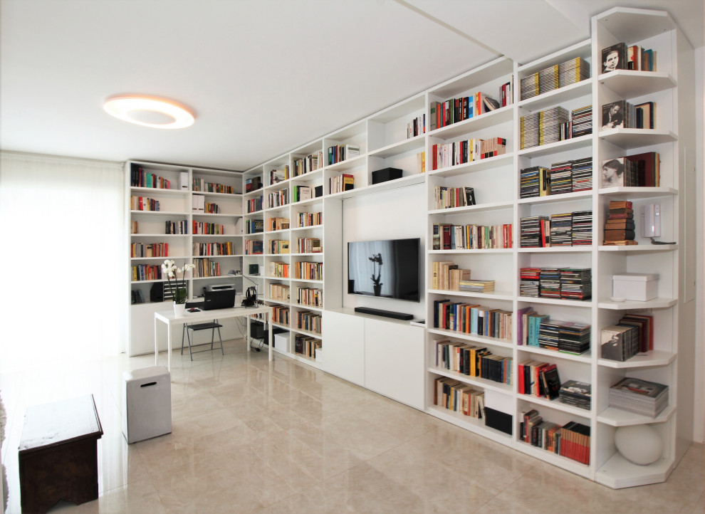 Immagine di un soggiorno minimal con libreria e pavimento in gres porcellanato