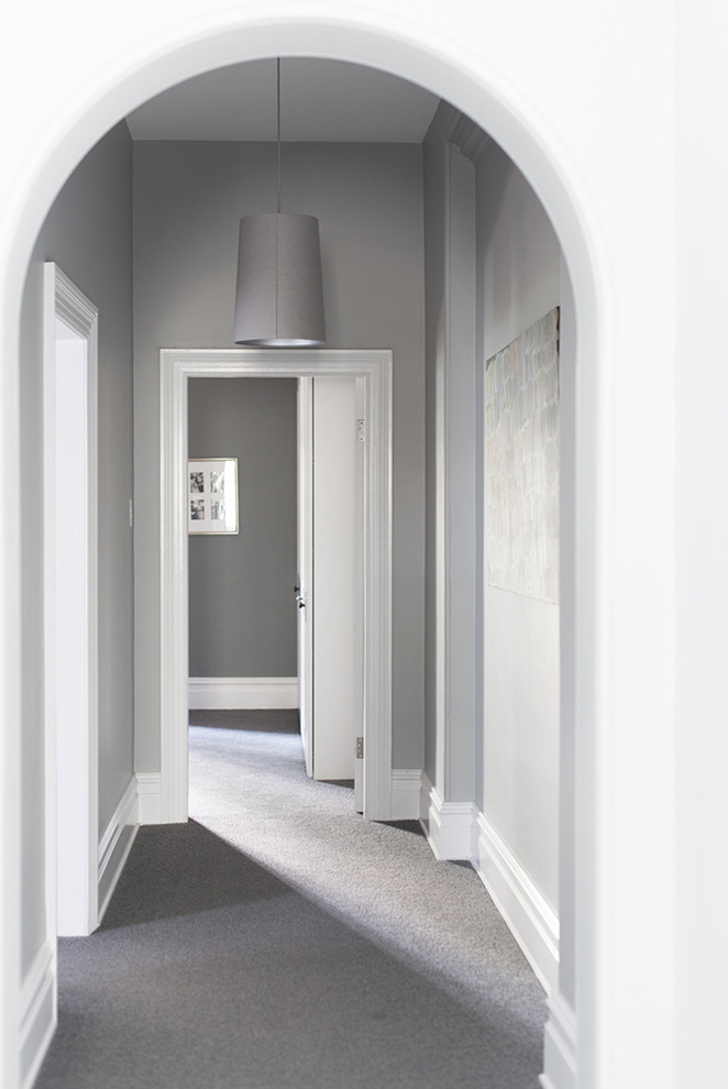 Photo of a large traditional hallway in Sydney with grey walls, carpet and grey floor.