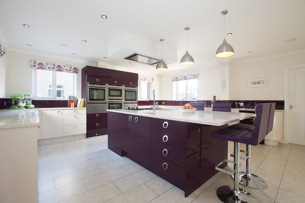This is an example of a large contemporary u-shaped eat-in kitchen in Other with an undermount sink, flat-panel cabinets, quartz benchtops, glass sheet splashback, stainless steel appliances, linoleum floors and with island.