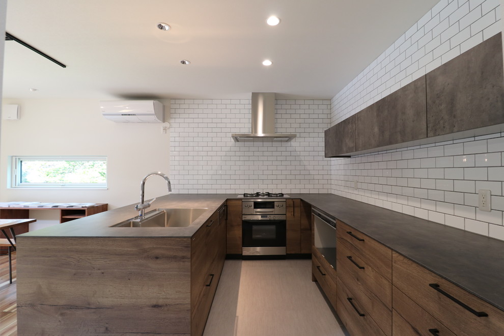 Contemporary u-shaped kitchen in Other with beaded inset cabinets, medium wood cabinets, laminate benchtops, brown splashback, subway tile splashback, vinyl floors, grey floor, brown benchtop and a single-bowl sink.
