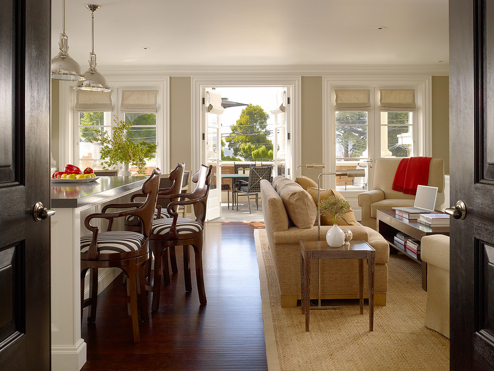 This is an example of a large contemporary open concept family room in San Francisco with beige walls and medium hardwood floors.