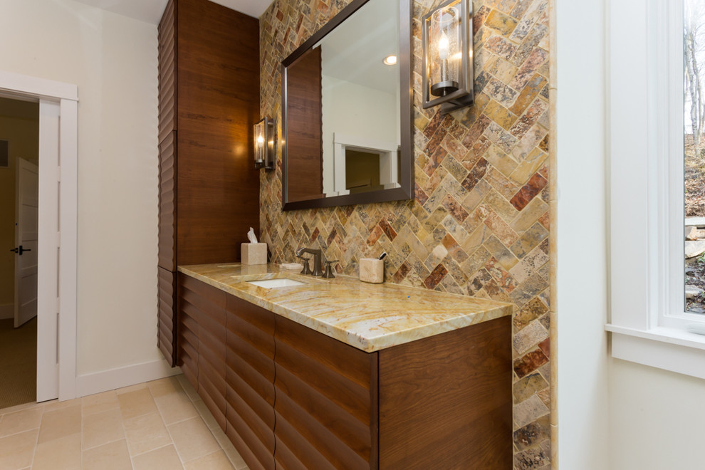 Large country master bathroom in Philadelphia with raised-panel cabinets, medium wood cabinets, a freestanding tub, an open shower, multi-coloured tile, stone tile, beige walls, terra-cotta floors, an undermount sink and marble benchtops.