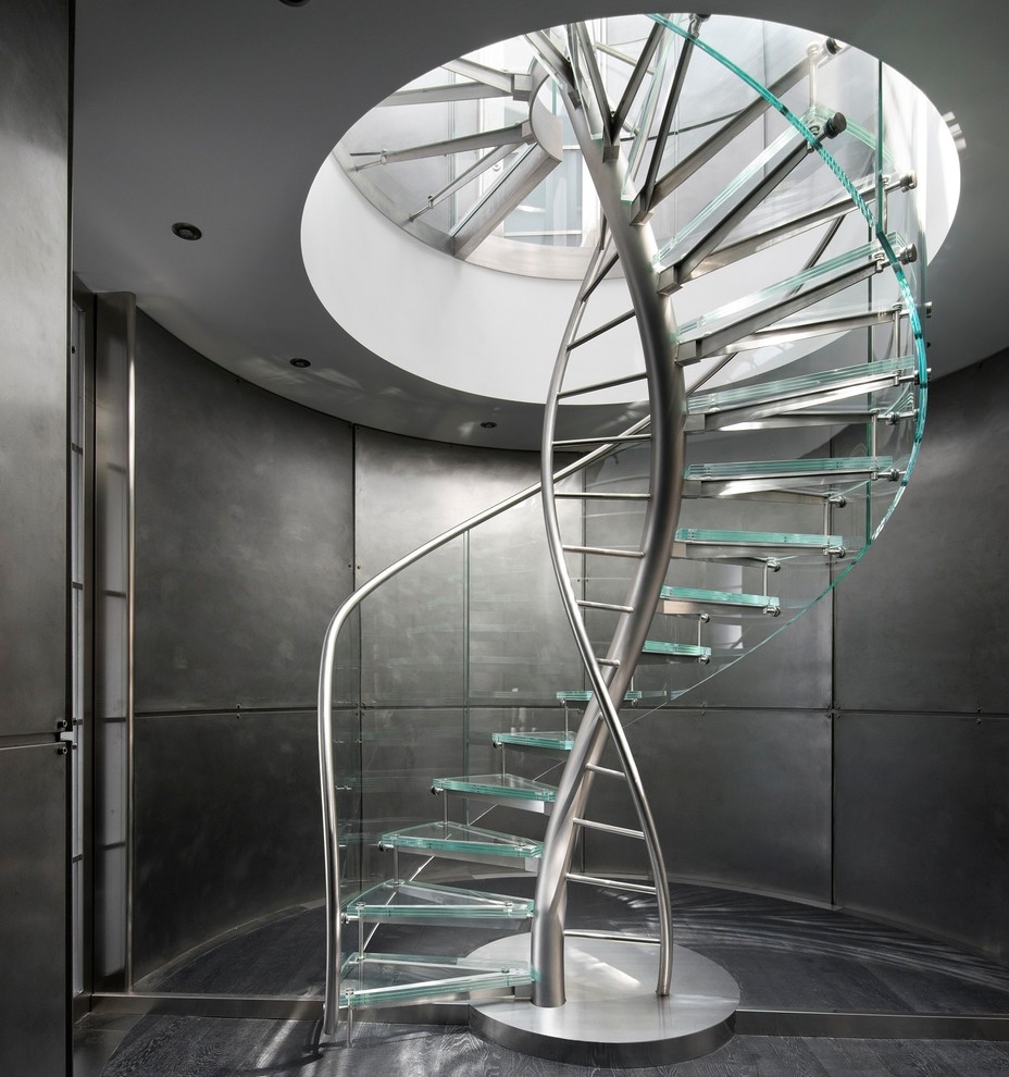 Contemporary glass curved staircase in Other with open risers.
