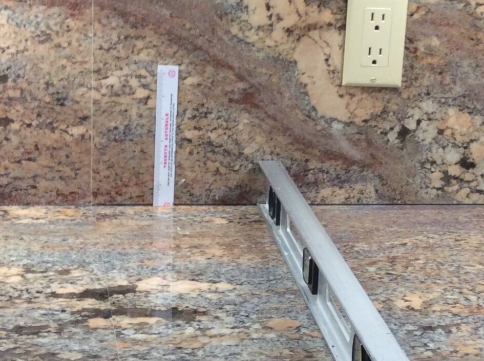 Gap between granite counter top and full height backsplash