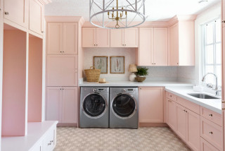 A pink and white iron sitting on top of a table photo – Laundry