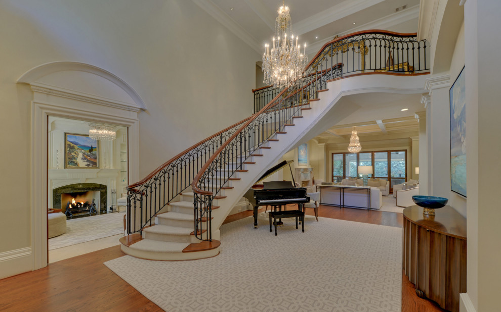 This is an example of a mid-sized traditional foyer in Atlanta with a double front door and a dark wood front door.