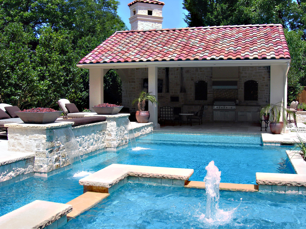 Mediterranean custom-shaped pool in Dallas with a water feature.