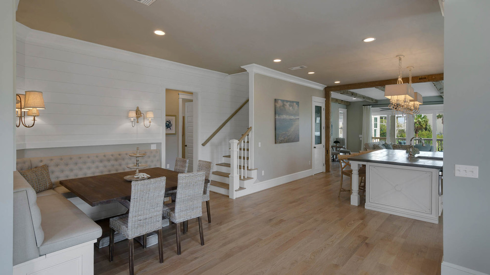 Inspiration for a mid-sized beach style kitchen/dining combo in San Diego with light hardwood floors and beige walls.