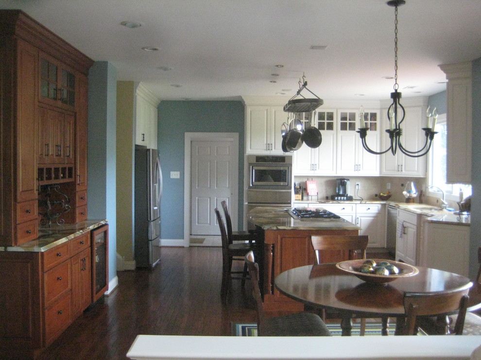Example of a mid-sized transitional l-shaped dark wood floor open concept kitchen design in Philadelphia with a double-bowl sink, shaker cabinets, white cabinets, onyx countertops, beige backsplash, cement tile backsplash, stainless steel appliances and an island