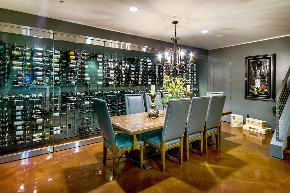 Contemporary wine cellar in San Francisco with concrete floors and display racks.
