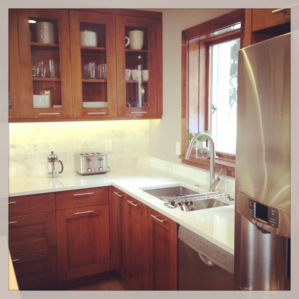 Example of a transitional kitchen design in Denver