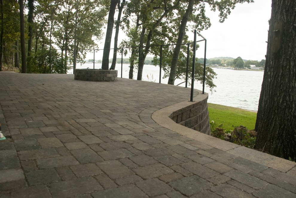 This is an example of a traditional backyard patio in Birmingham with brick pavers.