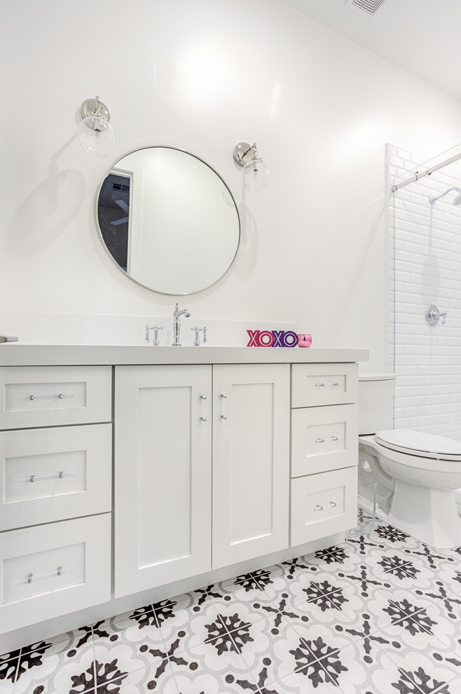 Example of a large transitional kids' black and white tile bathroom design in Phoenix with shaker cabinets and white cabinets