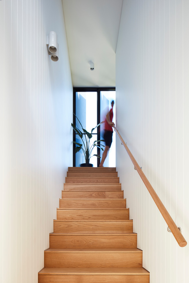 Mid-sized contemporary wood straight staircase in Melbourne with wood risers and wood railing.