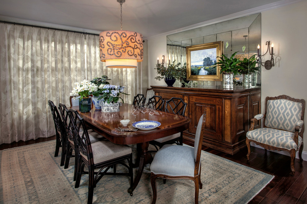 Photo of a mid-sized transitional separate dining room in Orange County with white walls and dark hardwood floors.