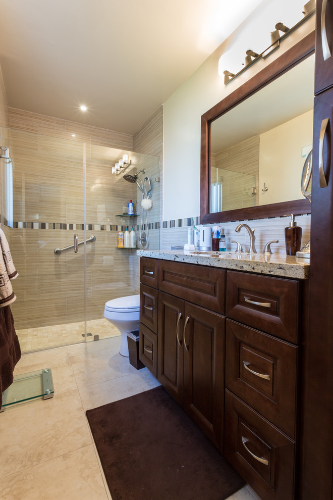Inspiration for a small transitional kids' beige tile and porcelain tile porcelain tile alcove shower remodel in Miami with an undermount sink, shaker cabinets, medium tone wood cabinets, granite countertops, a two-piece toilet and beige walls